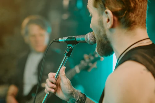bearded-guy-singing-into-microphone-2025-02-10-13-19-51-utc