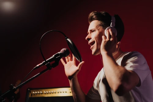 young-man-record-a-song-in-recording-studio-2024-10-18-04-58-00-utc